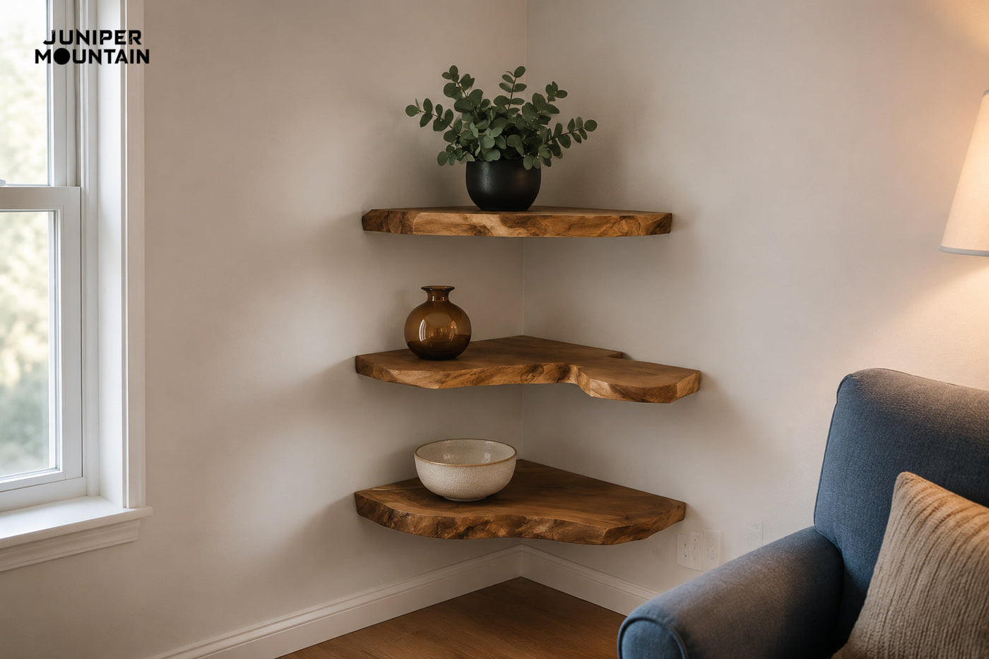 Three brown live-edge corner shelves styled with a plant, amber vase and cream bowl