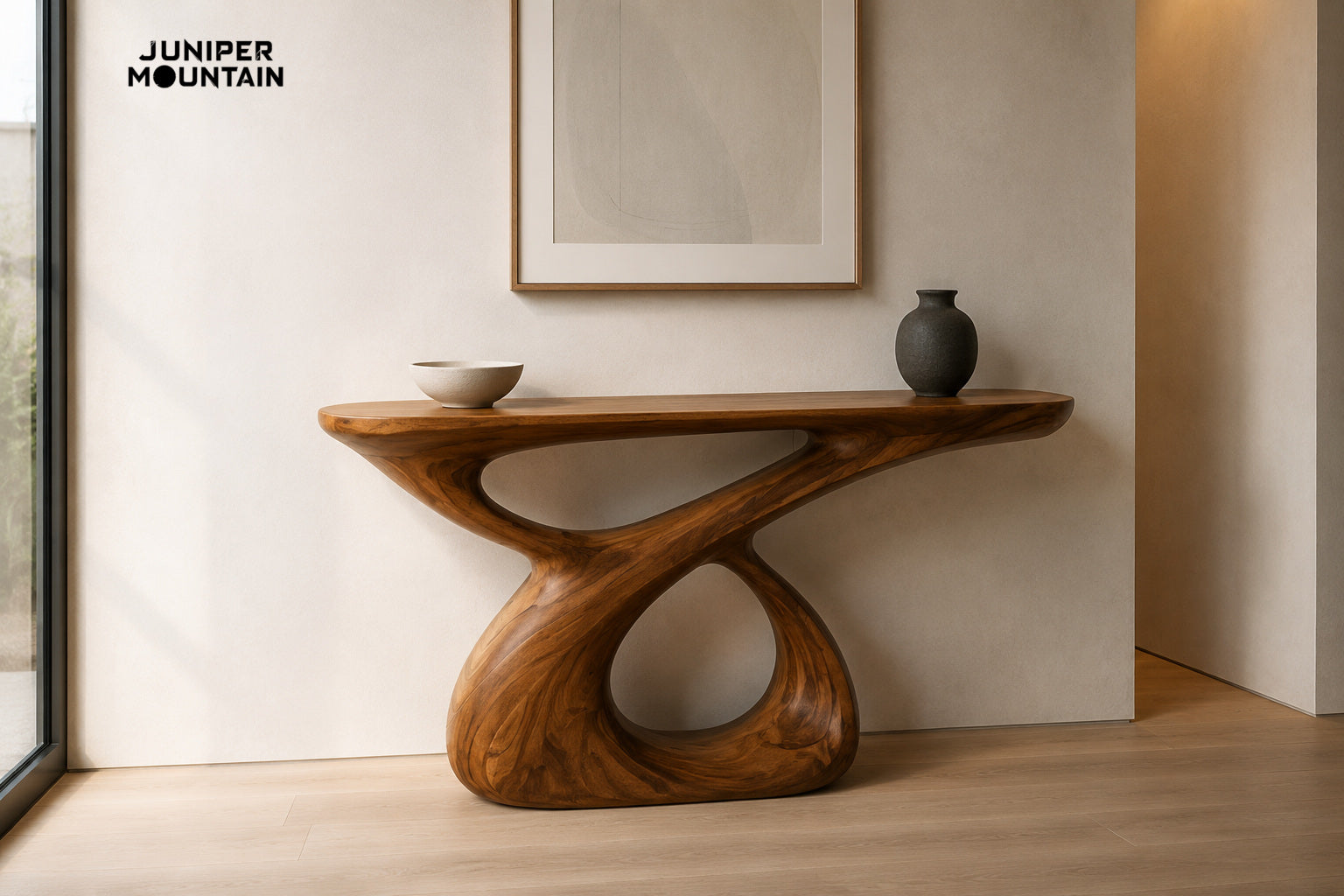 Brown loop-base console table with an ivory bowl and charcoal vase against a pale entryway wall; generated styling illustration.
